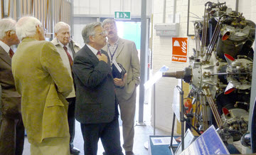 Members looking at a Bristol Jupiter II engine in the museum
