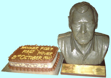 Anniversary cake and a bust of Bill Bedford