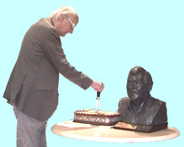 Ralph cutting the cake